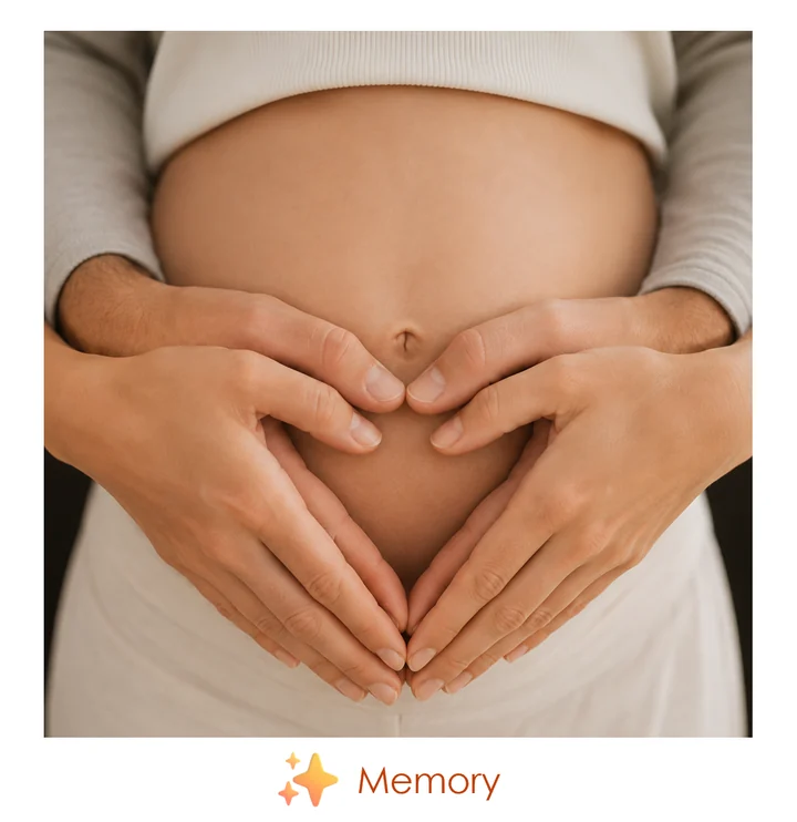 Polaroid of a pregnant belly with hands in a heart shape, captioned Memory